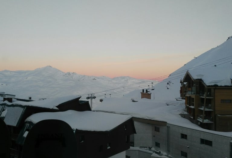 Alpine evening atmosphere around the Val Thorens snow front with mountain views