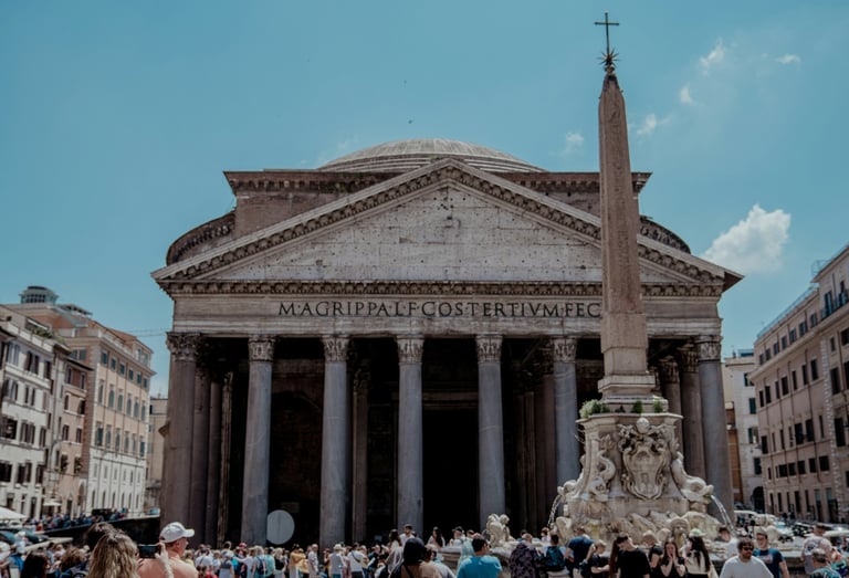 Exterior of the Pantheon in Rome with large columns and a domed roof