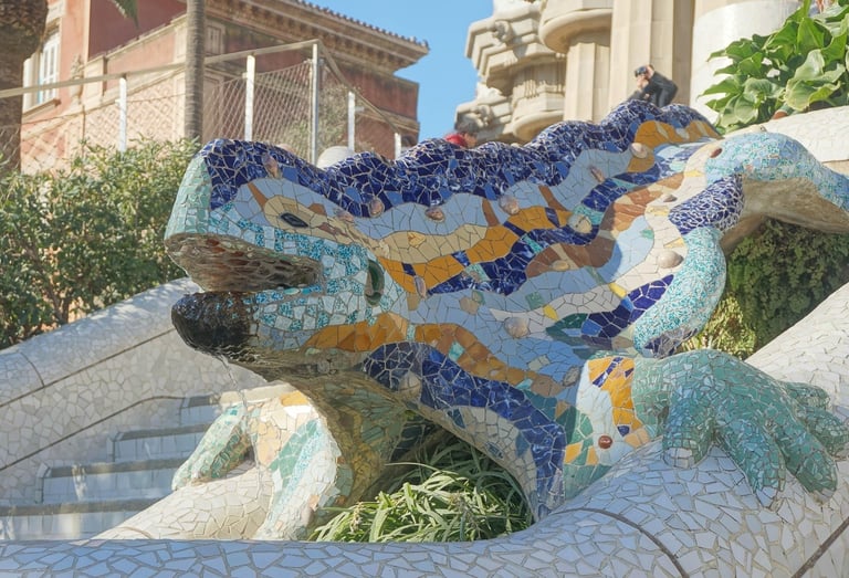 Colourful mosaic lizard sculpture (El Drac) on the staircase at Park Güell