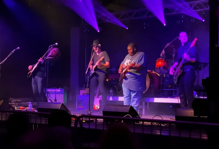 Andy Timmons, Andy Wood, Christone "kingfish" Ingram, Ben Eller, and Andy Campbell on stage playing