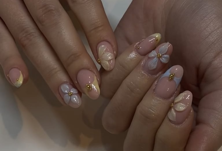 a woman's hands with a manicured manicured manicured nails