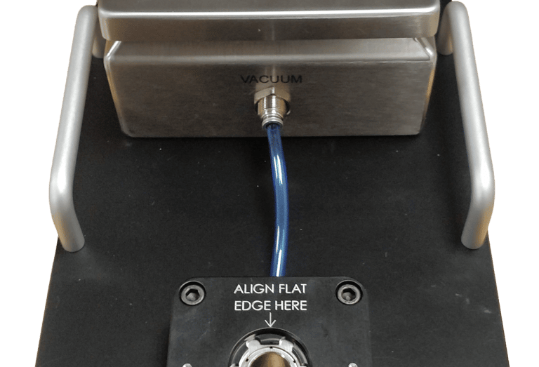 Vacuum metrology fixture for holding a soft rubber medical dome