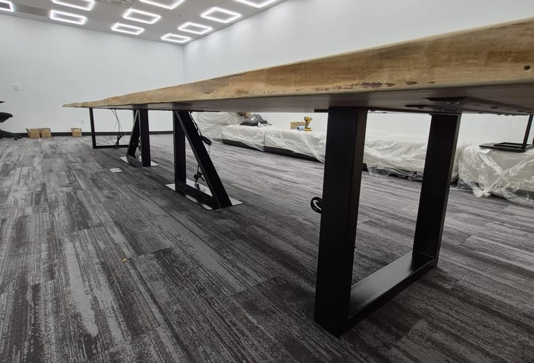 Custom maple boardroom table — steel base detail and surface edge view