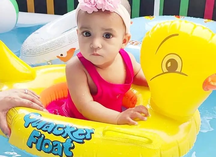 child playing with water aith yellow duck at Enfant pre school Ghaziabad