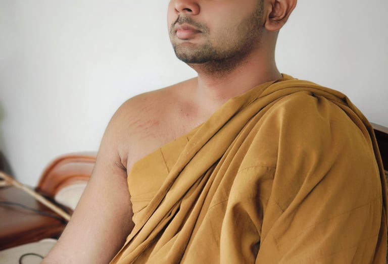 a man in a robe is sitting on a couch