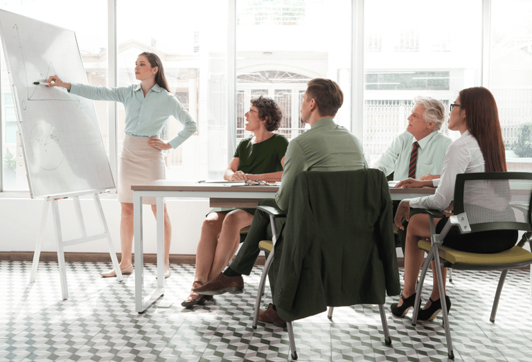 a woman in a business suit is standing in front of a white boardroom