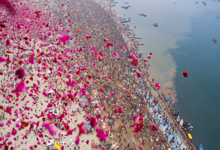 Flower petals being showered on tourists at Maha Kumbh at Prayagraj