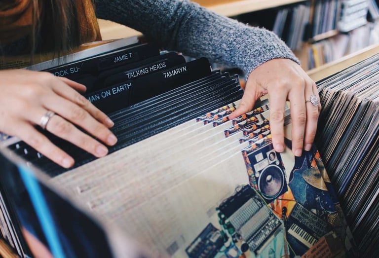 Someone browsing through vinyl records