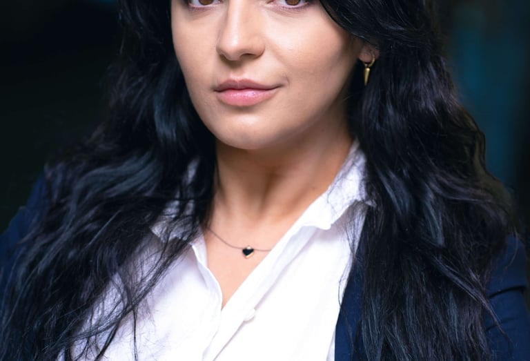a woman with long hair and a white shirt