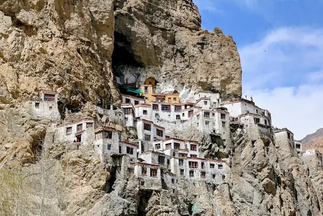 Phuktal Monastery built into a cliffside in the remote landscapes of Ladakh
