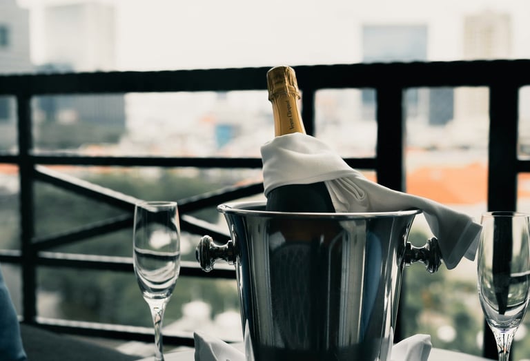 Chilled champagne bucket with two glasses; Photo by Albert Vincent Wu on Unsplash
