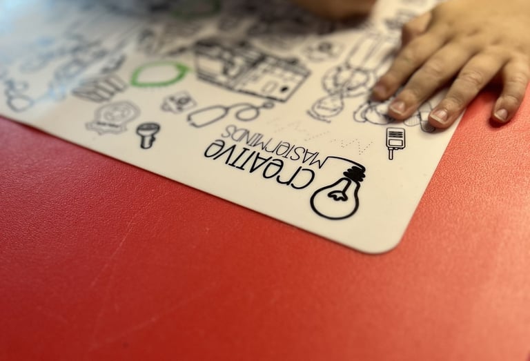 Toddler using Scribbly Kids reusable drawing mat at home for mess-free drawing and learning