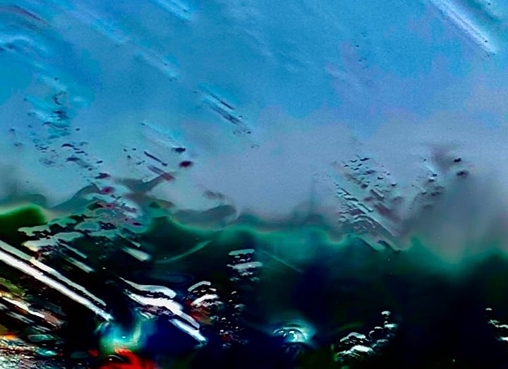 a surfer in the water with a surfboard