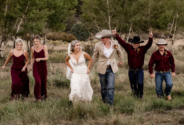 wedding party running outdoors