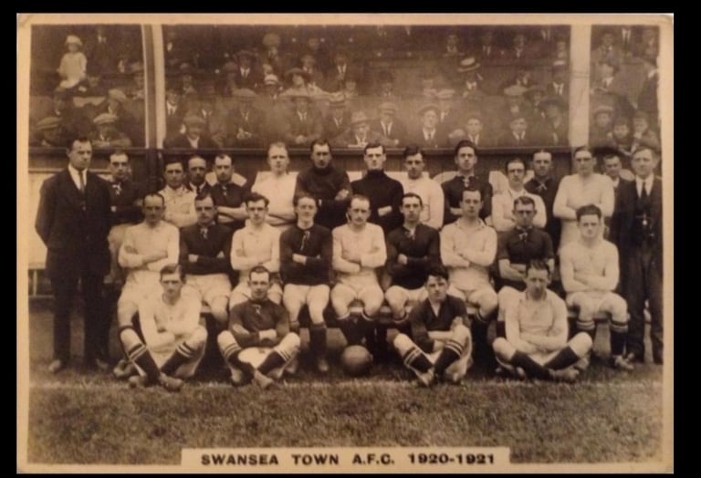 Vintage black and white team photo of Swansea Town A.F.C. football players from the 1920-1921 season.