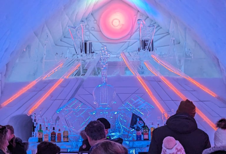 ice hotel evening with people gathered around the bar