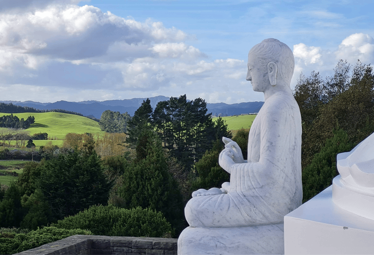 Statue overlooking nature — symbol of reflection and feminine sovereignty