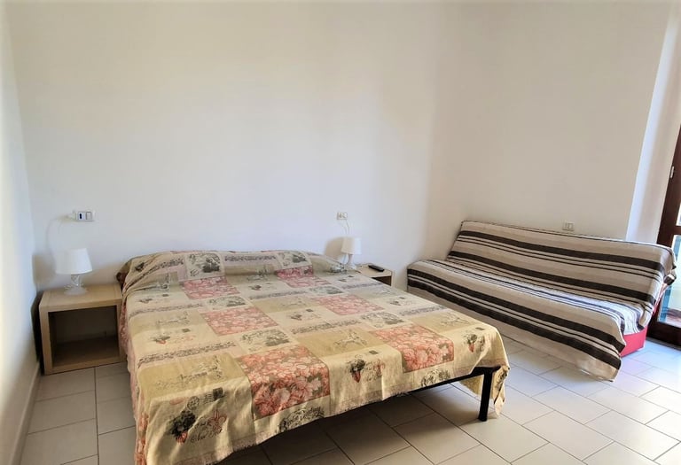 a bed with a couch and a couch