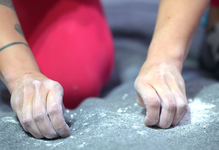 a climber is cleaning up climbing chalk