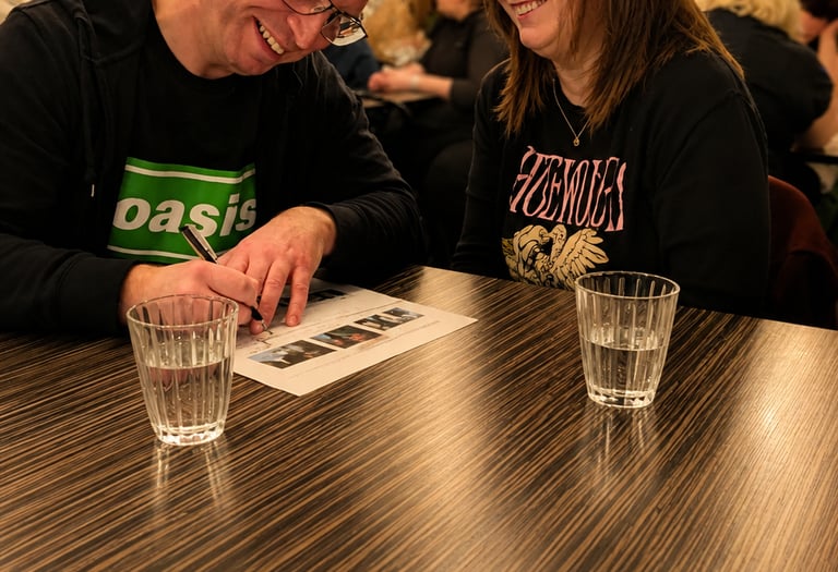 a man and a woman enjoy themselves at a quiz.
