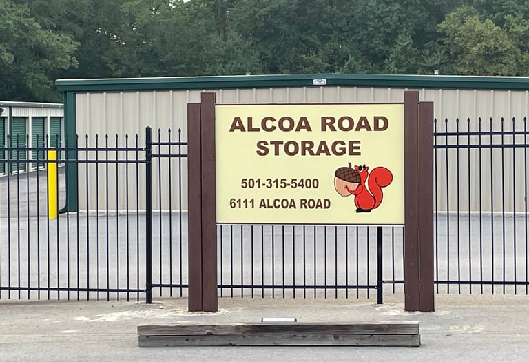 Signage at Alcoa Road Storage and drive up storage units at main office.