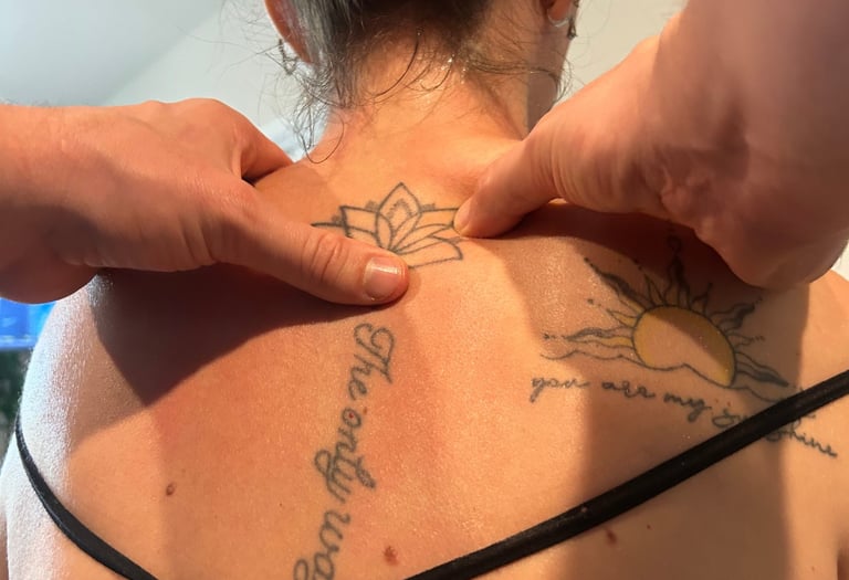 Dr Mitch working on relaxing and loosening upper back muscles