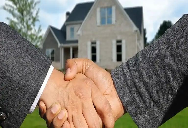 Buisness partners shaking hands for a real estate joint venture project