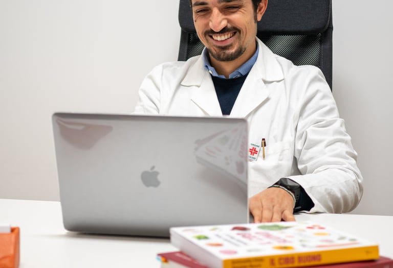 a man in a lab coat sitting at a desk