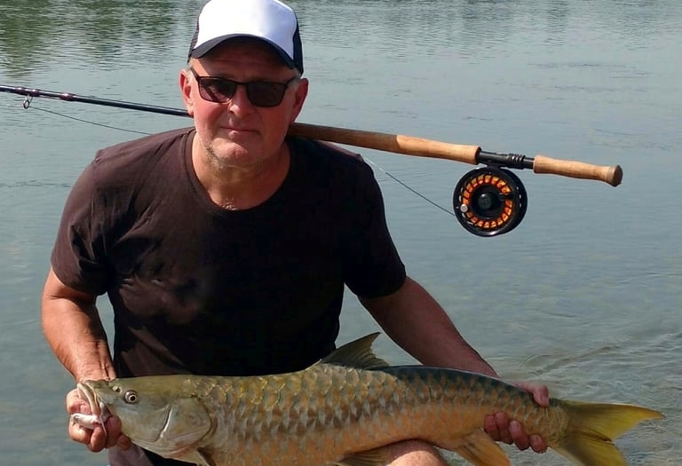 Catching Himalayan Golden Mahseer on the fly.