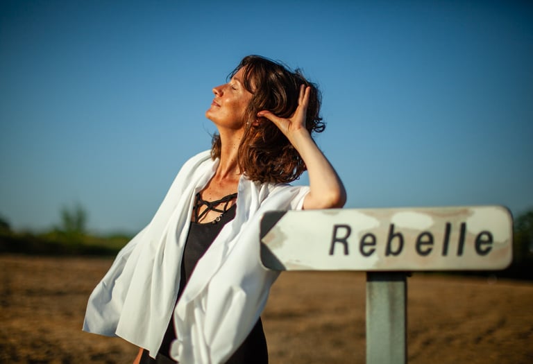 a rebel woman in a white robe