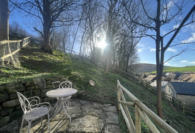 a garden from a holiday cottage overlooking west lulworth village