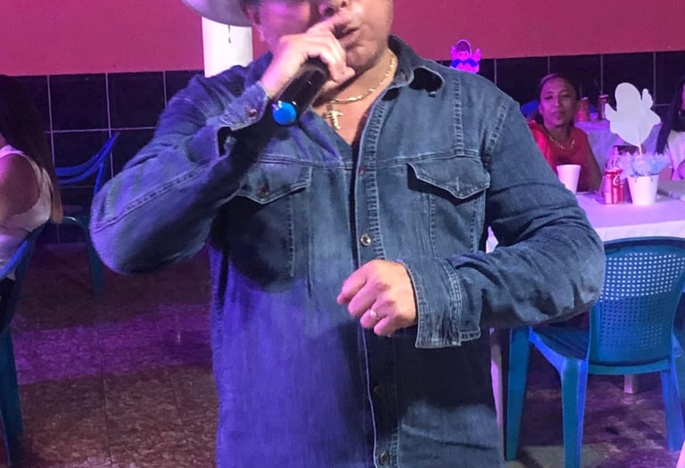 a man in a cowboy hat talking on a cell phone