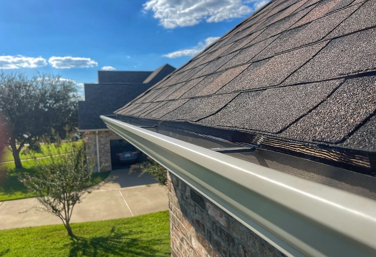 Brand new gutters installed following a full roof replacement for customer in Bullard, TX
