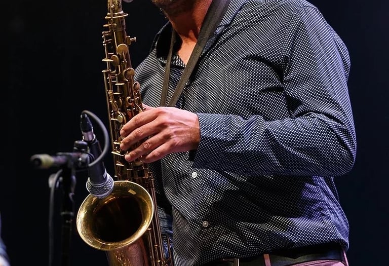 a man playing a saxophone and saxophone