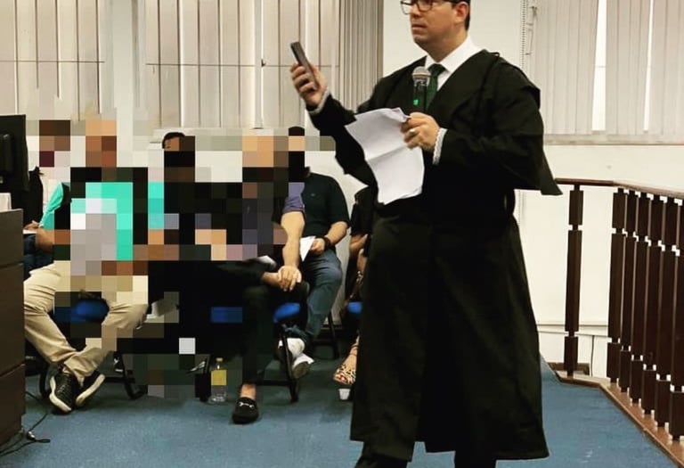 a man in a suit and tie is holding a cell phone