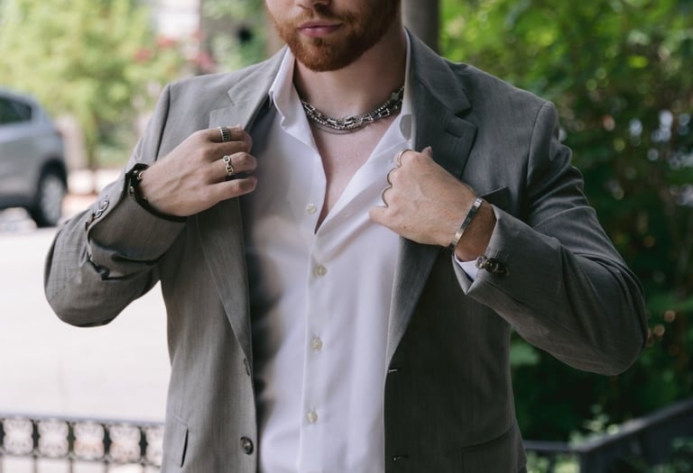 a man in a suit jacket and a white shirt