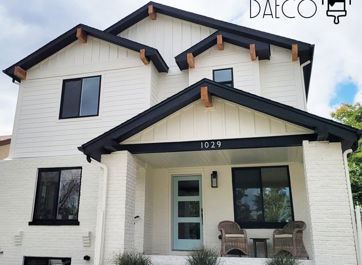 a white house with a black and white trimming