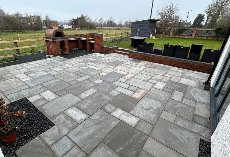 grey garden slabs professionally cleaned by home maintenance experts