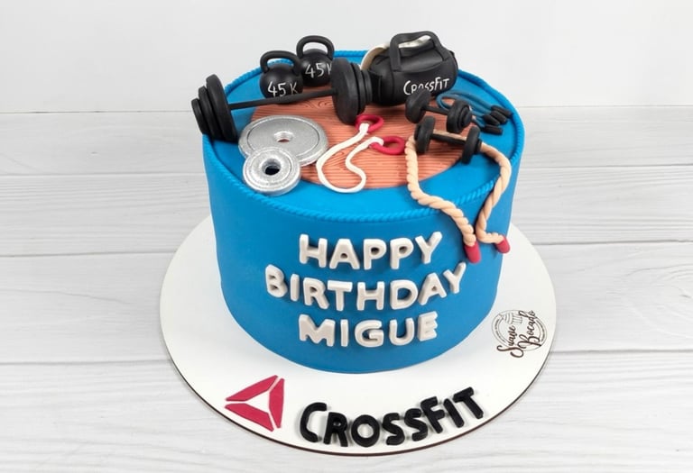a cake with a gym themed cake topper