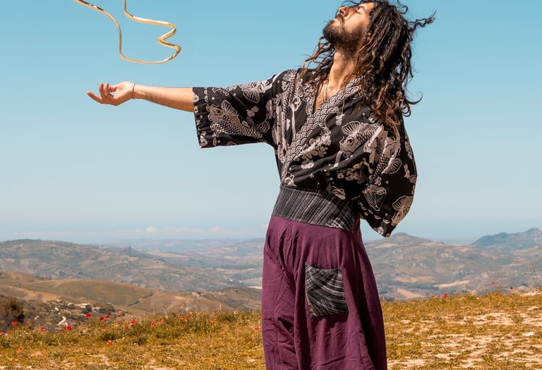 a man in a black dress and a kite kite