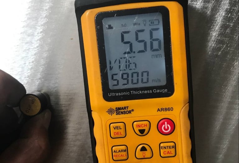 Ultrasonic thickness testing on ISO tank during inspection