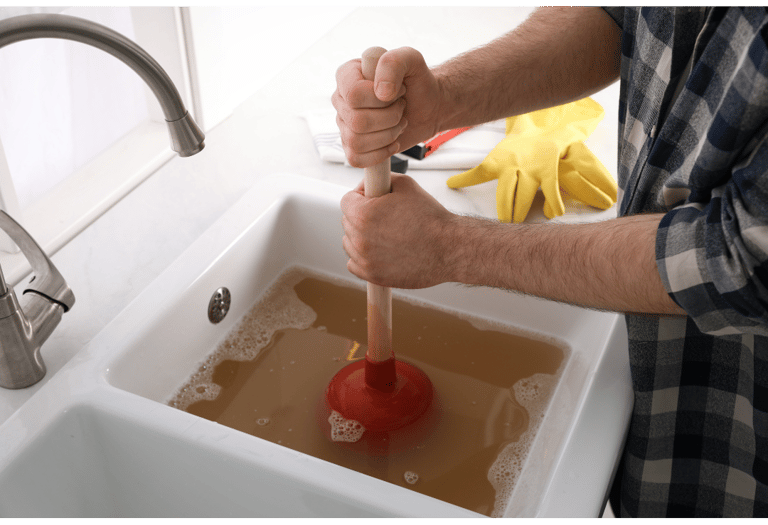 Plumber Unclogging and cleaning drain