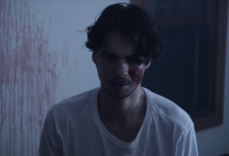 a man with a bloody face and a bloody face