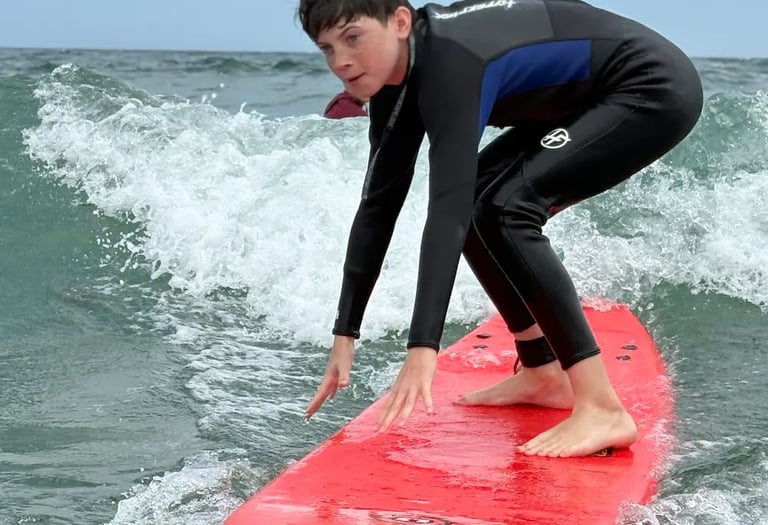 Teen boy surfing at north of Jenness Beach in Rye NH