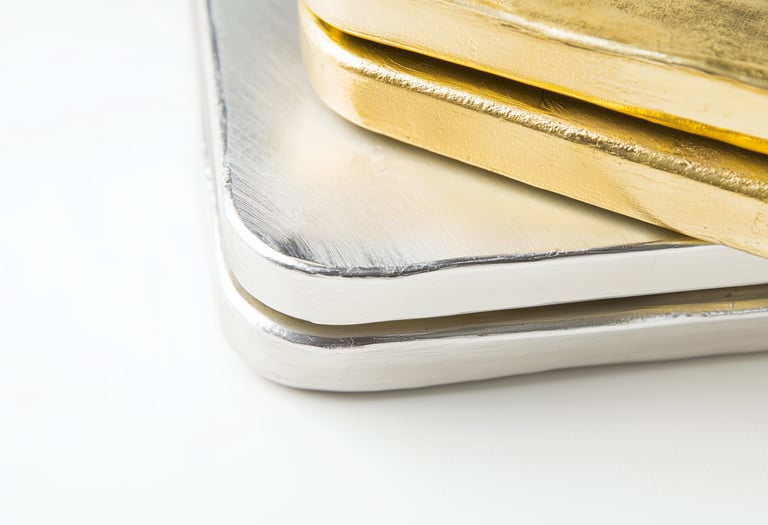 gold and silver bullion bars on top each other