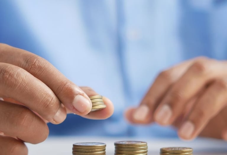 gold coins on table representing beginners guide to gold ira