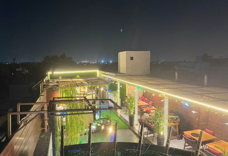 a rooftop bar with a view of a rooftop
