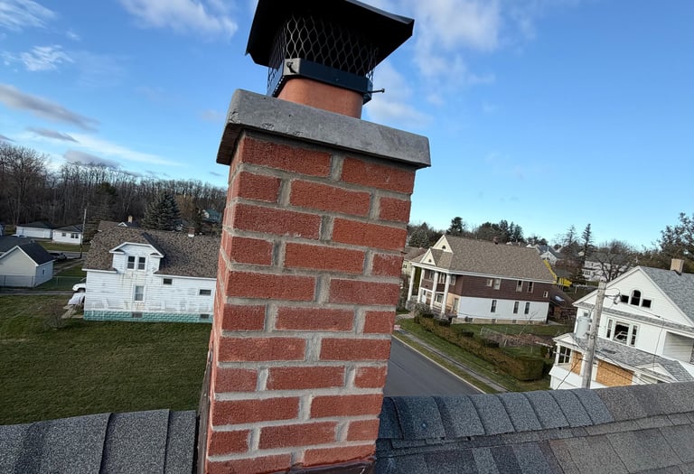 New chimney rebuild from roofline and up with new chimney crown done by Chimney professional 