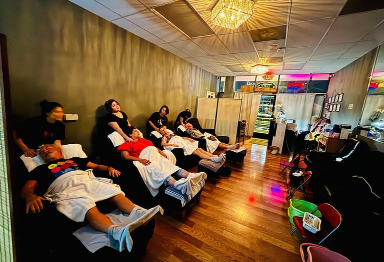 a group of people sitting in a row of chairs