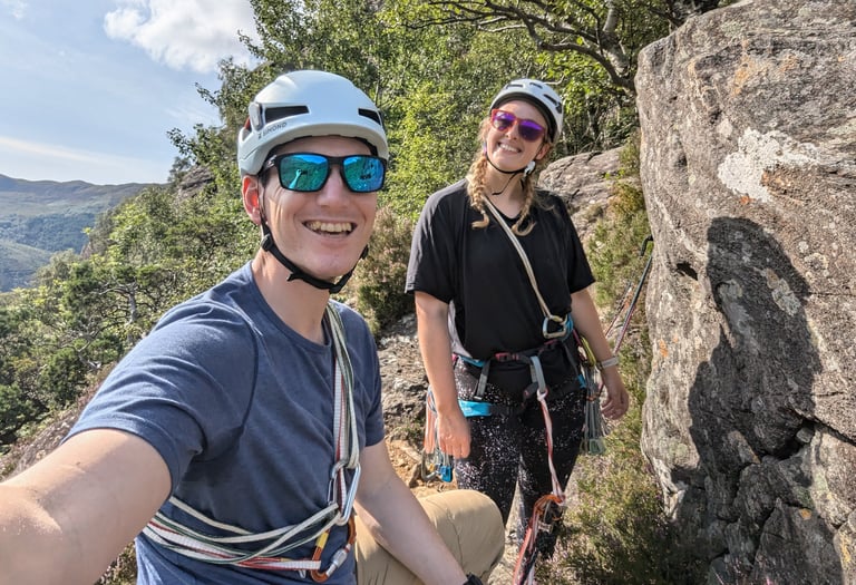 couple rock climbing